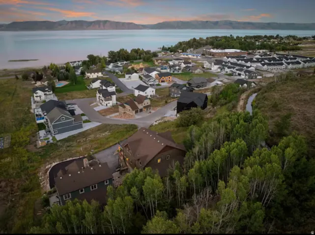 Aerial perspective of suburban area featuring a water and mountain view