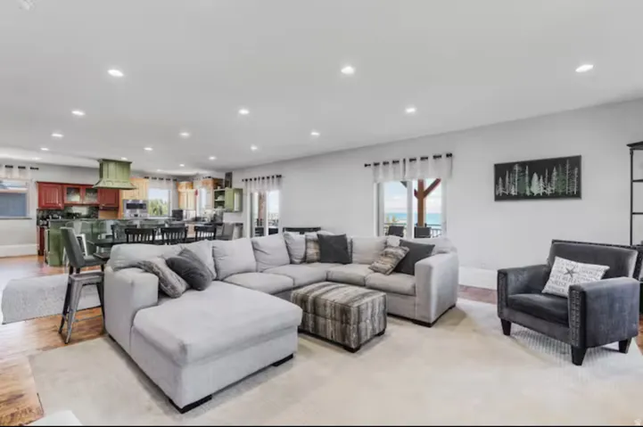Living area with recessed lighting and wood finished floors