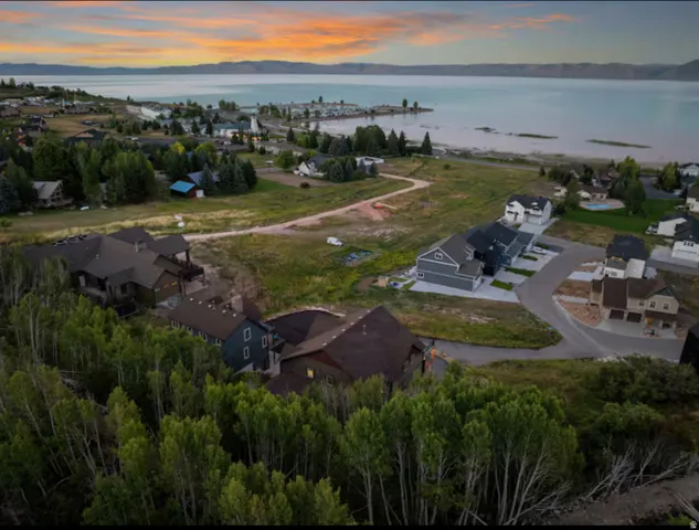 Aerial view at dusk of a water view and a residential view