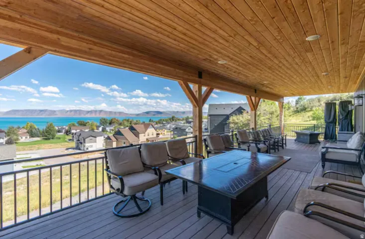 Deck with an outdoor lounge area, a mountain view, and a residential view
