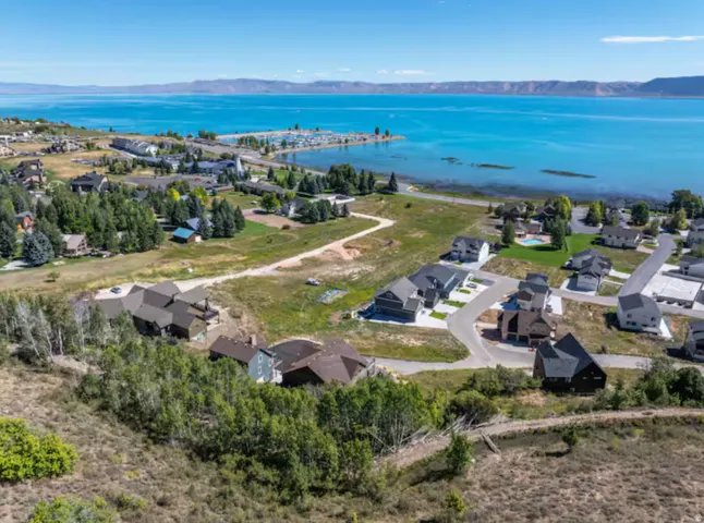 Aerial perspective of suburban area with a water and mountain view