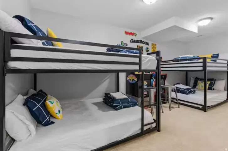 Bedroom featuring light colored carpet