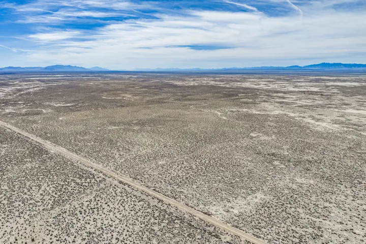 Aerial view of sparsely populated area with mountains