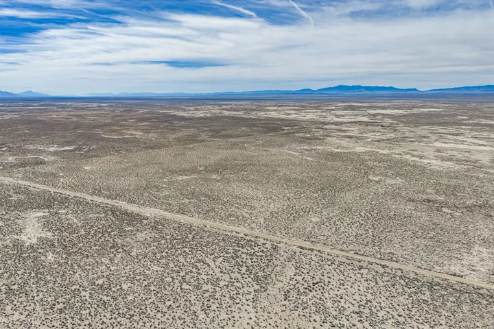 View of rural area with mountains and a desert landscape