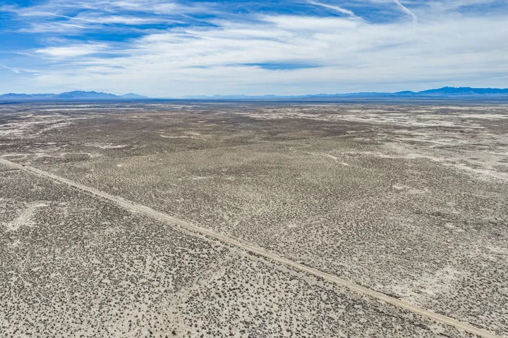 Aerial view of sparsely populated area with mountains