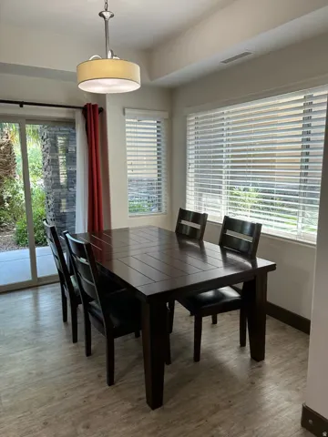 Dining space featuring plenty of natural light and wood finished floors