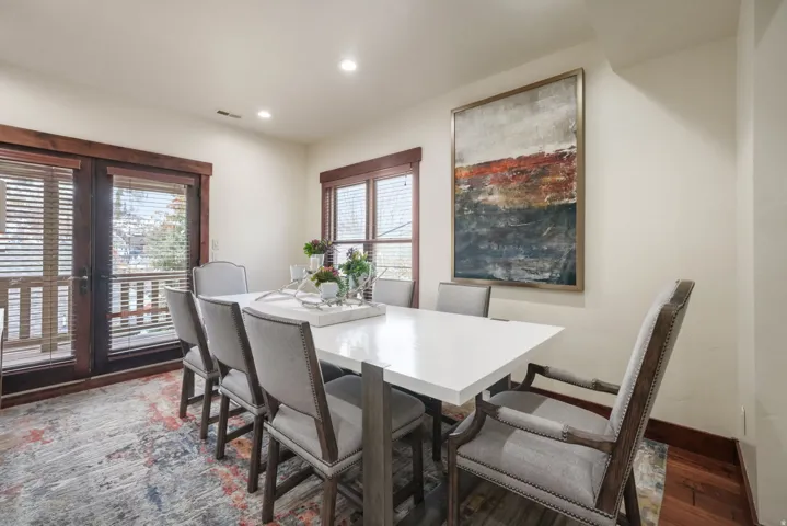 Dining space featuring wood finished floors and recessed lighting