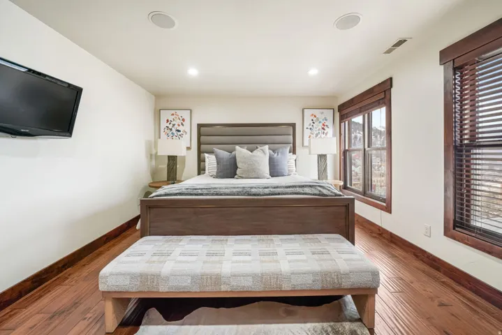 Bedroom with hardwood / wood-style floors