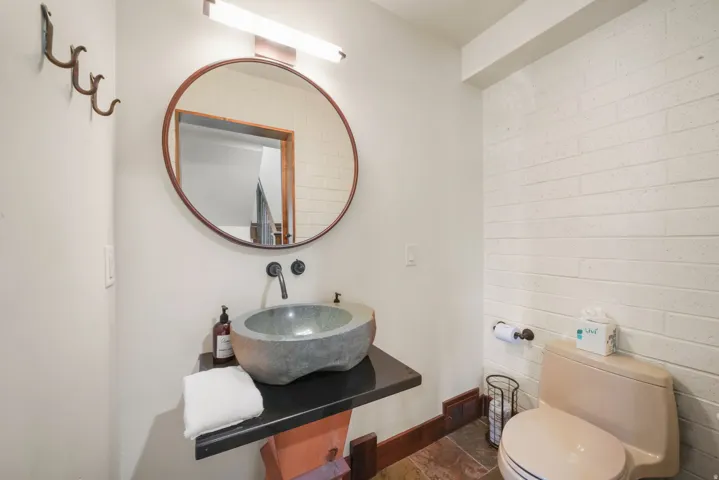 Bathroom featuring vanity and stone finish floors