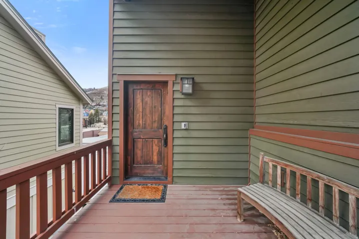 Property entrance featuring a deck