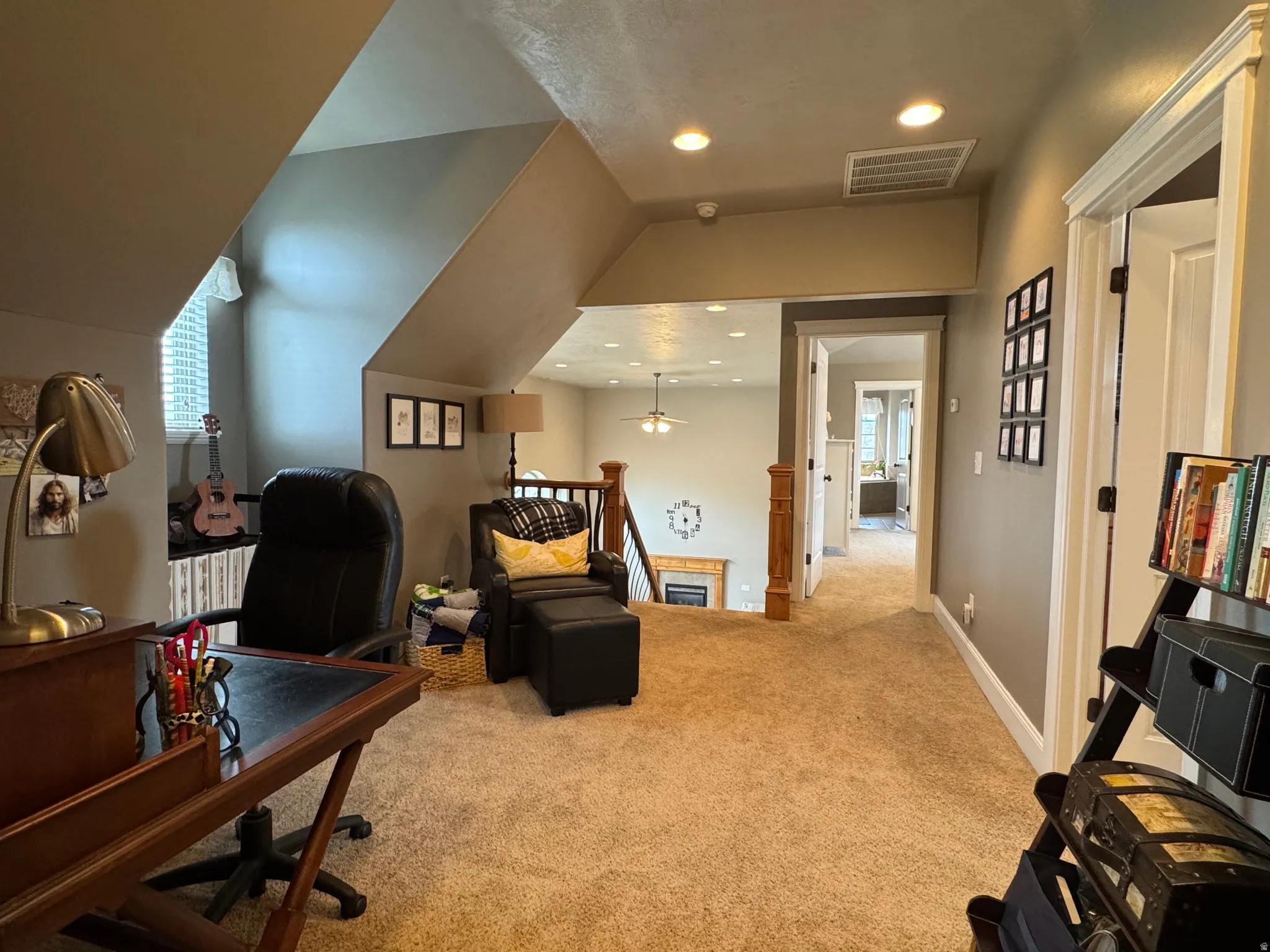 Office space featuring light carpet, plenty of natural light, recessed lighting, and ceiling fan
