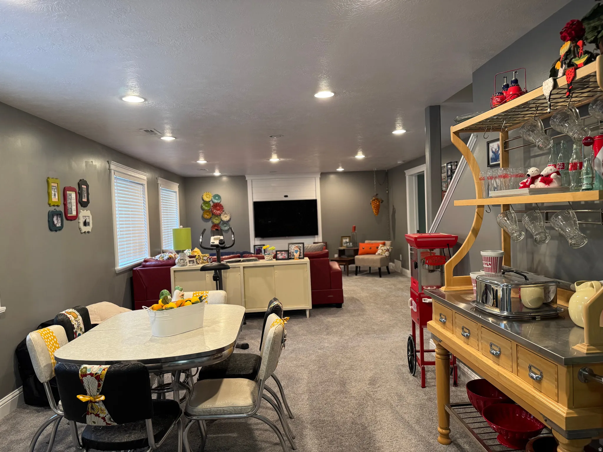 Carpeted dining space featuring recessed lighting
