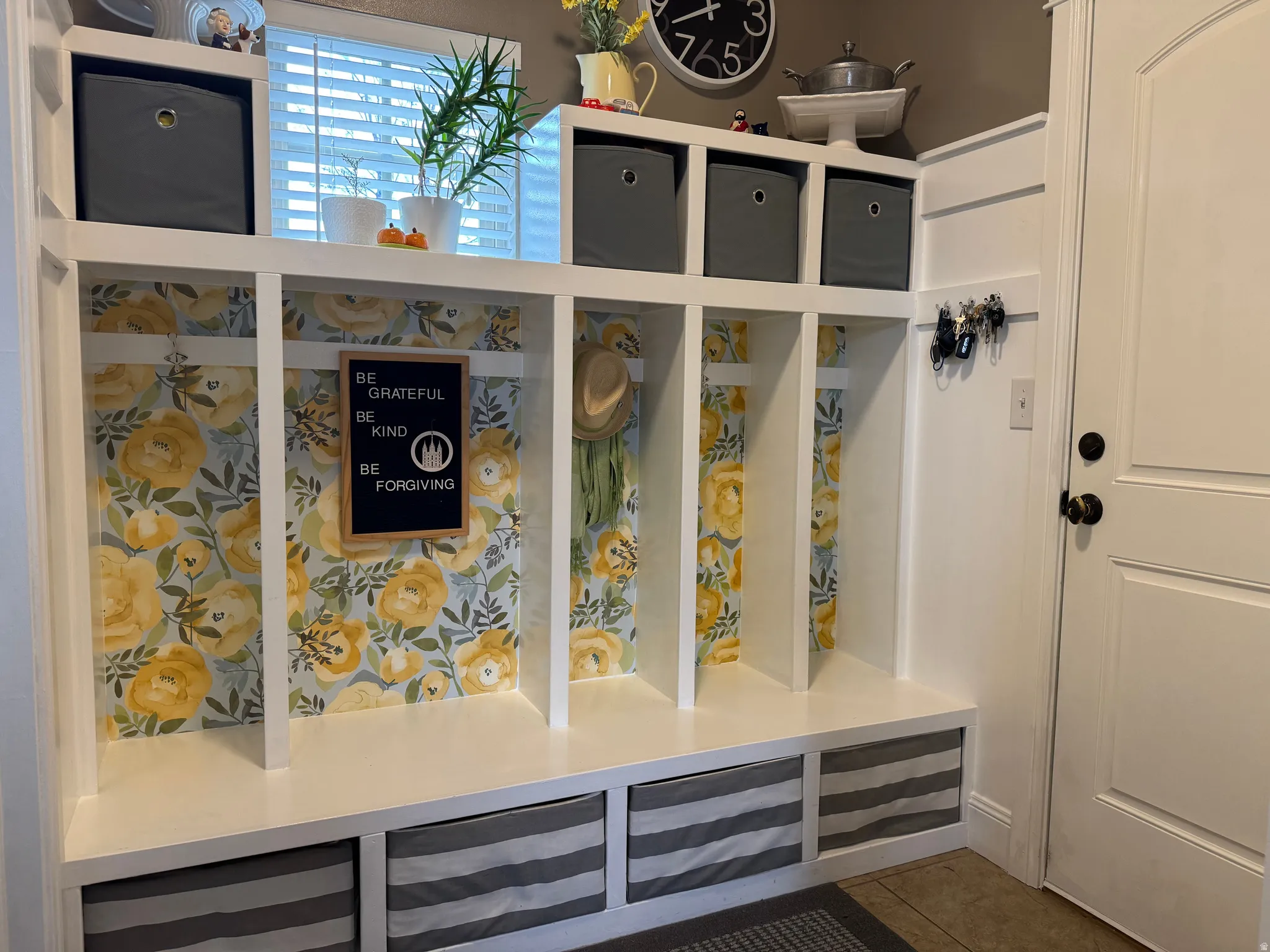 Mudroom with tile patterned floors