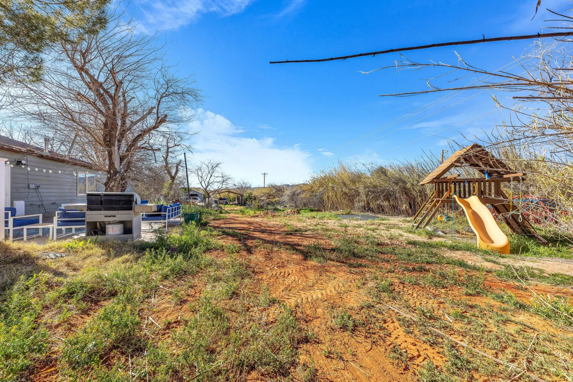 View of yard featuring a playground