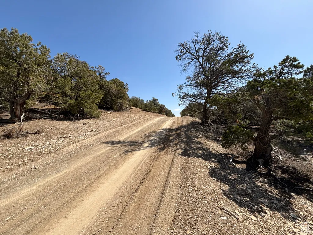 View of dirt / gravel road featuring a view of countryside