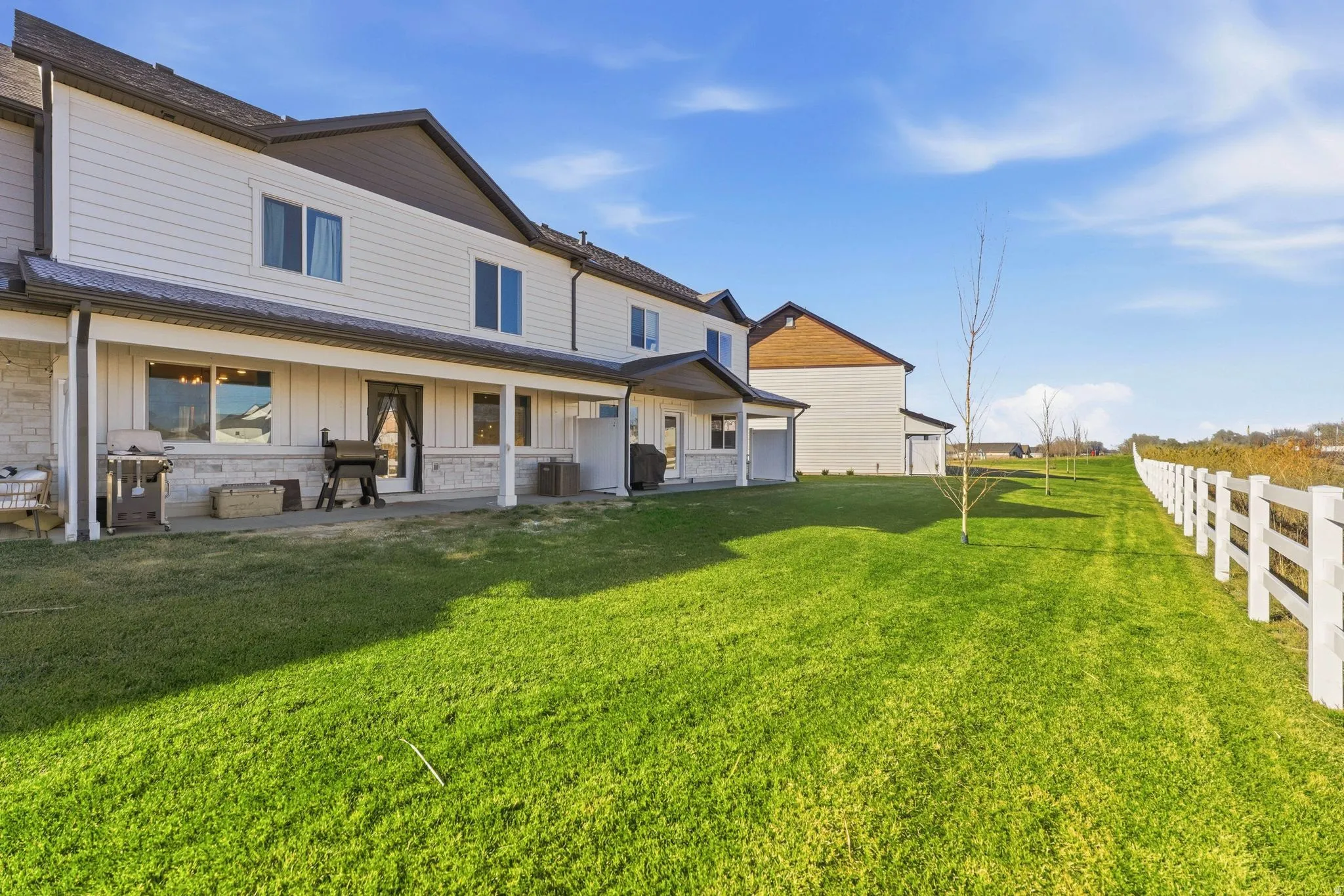 Rear view of property featuring board and batten siding