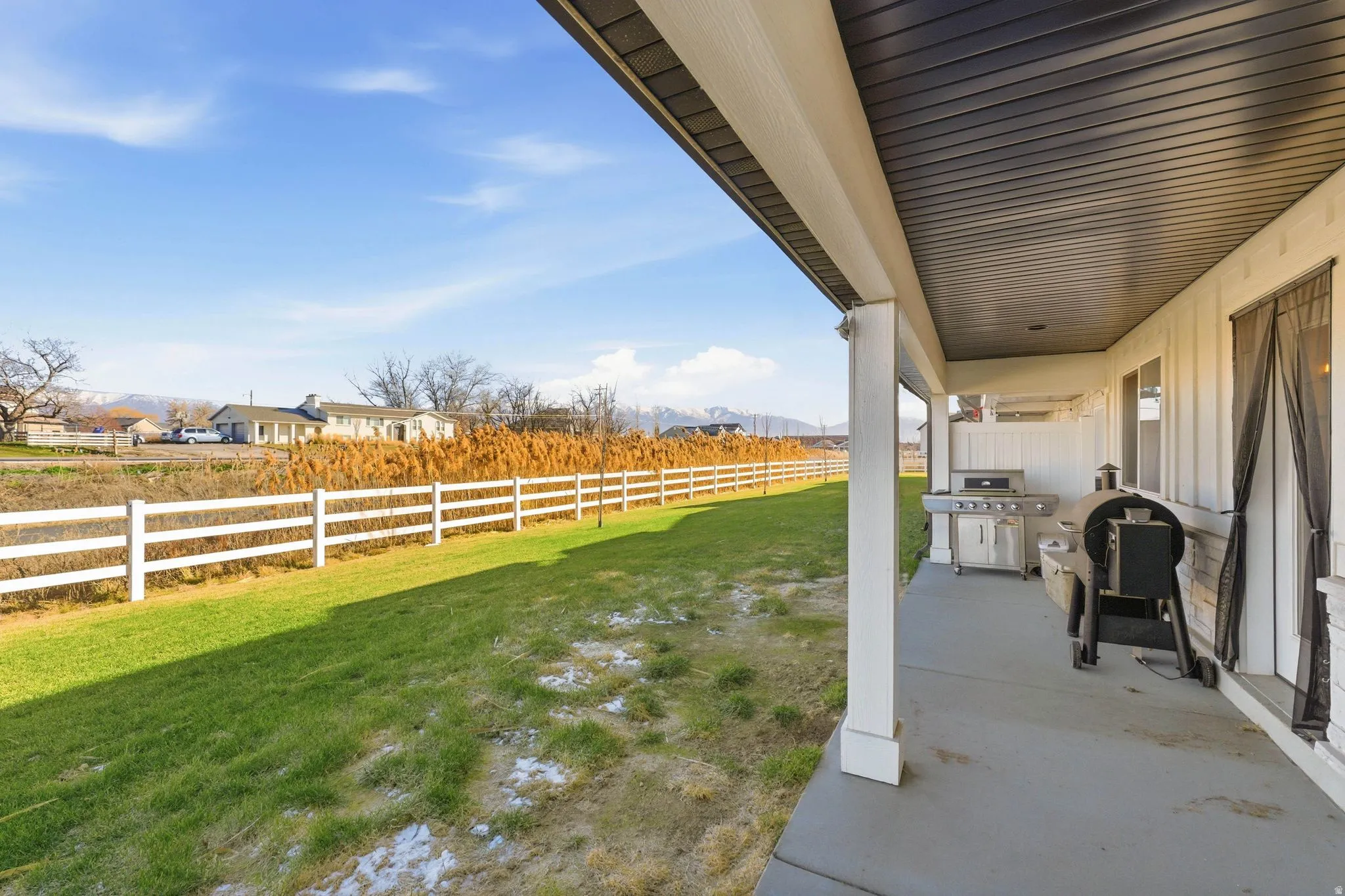 Fenced backyard featuring a patio