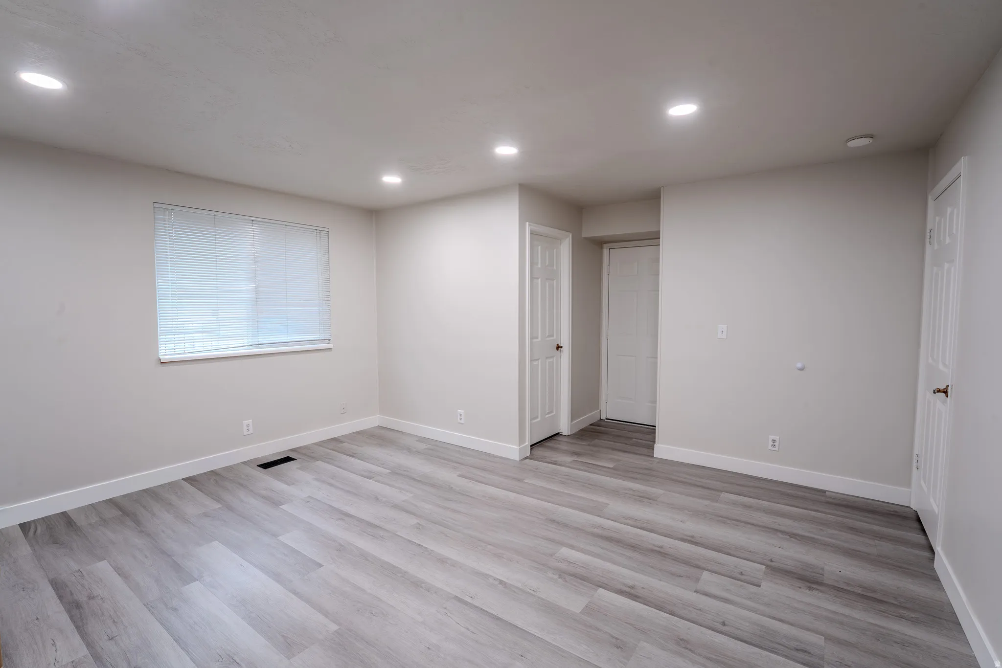 Unfurnished bedroom featuring recessed lighting and light wood-style floors
