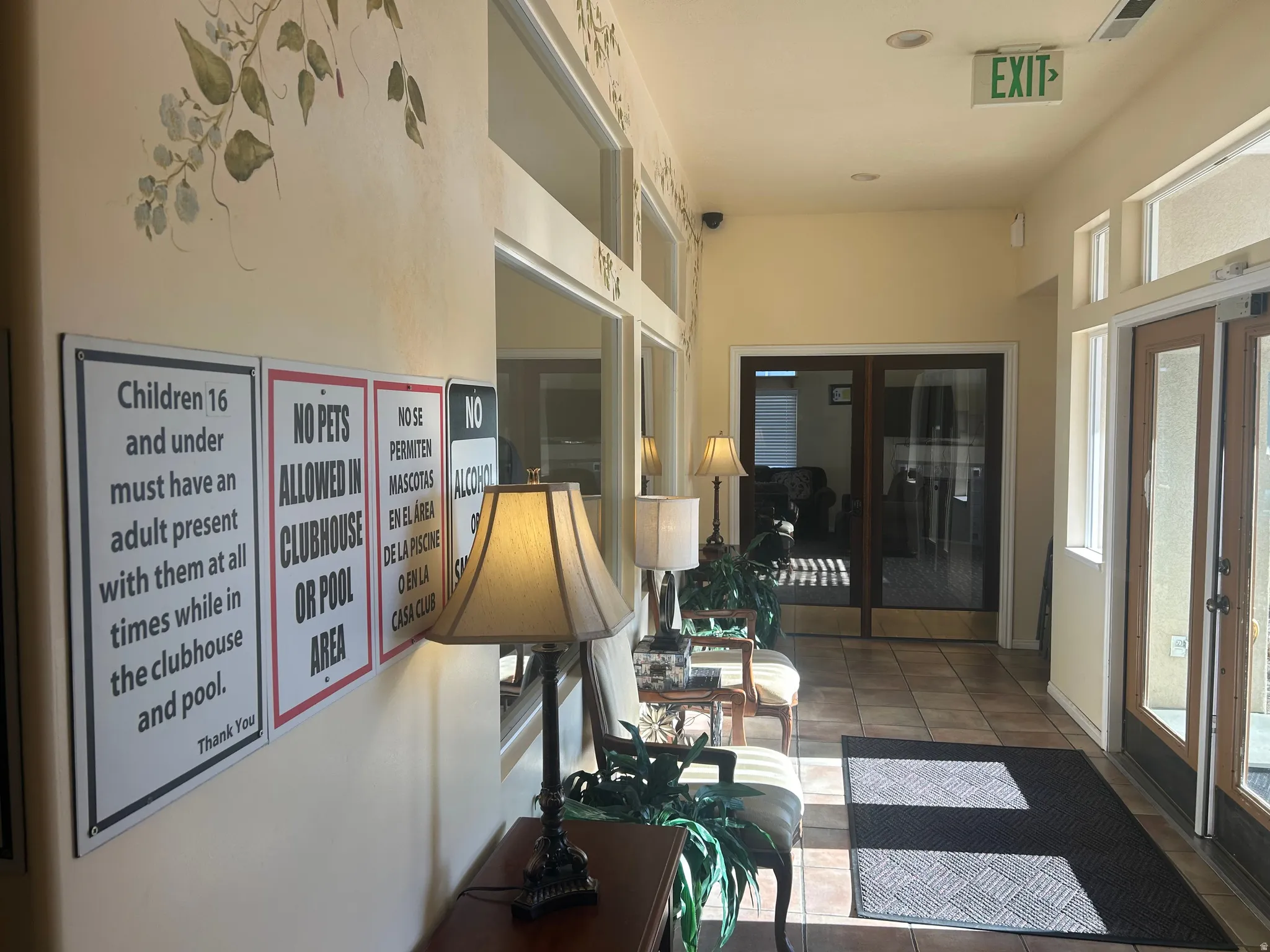 Interior space featuring dark tile patterned flooring and french doors