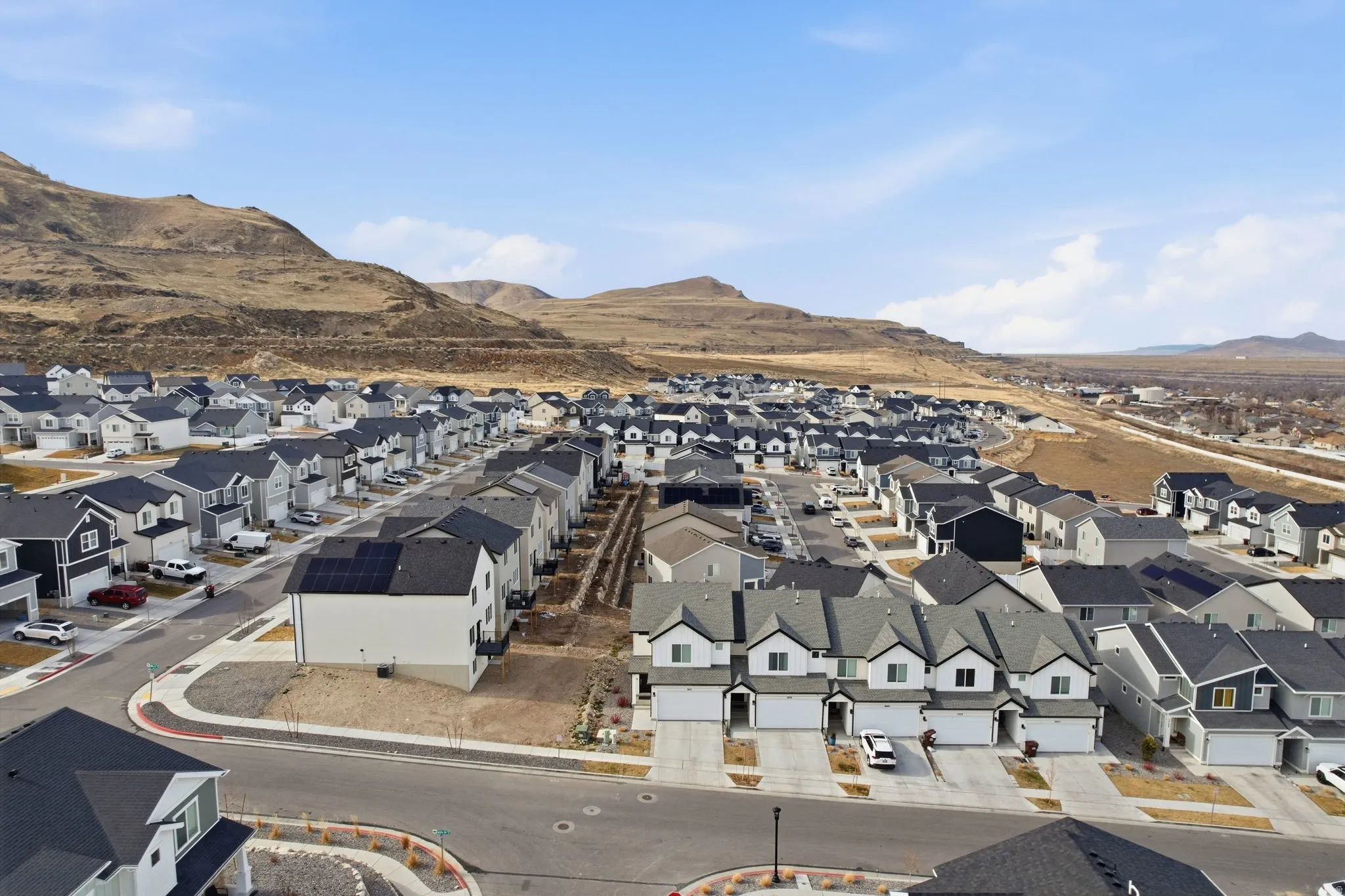 Aerial view of residential area with mountains