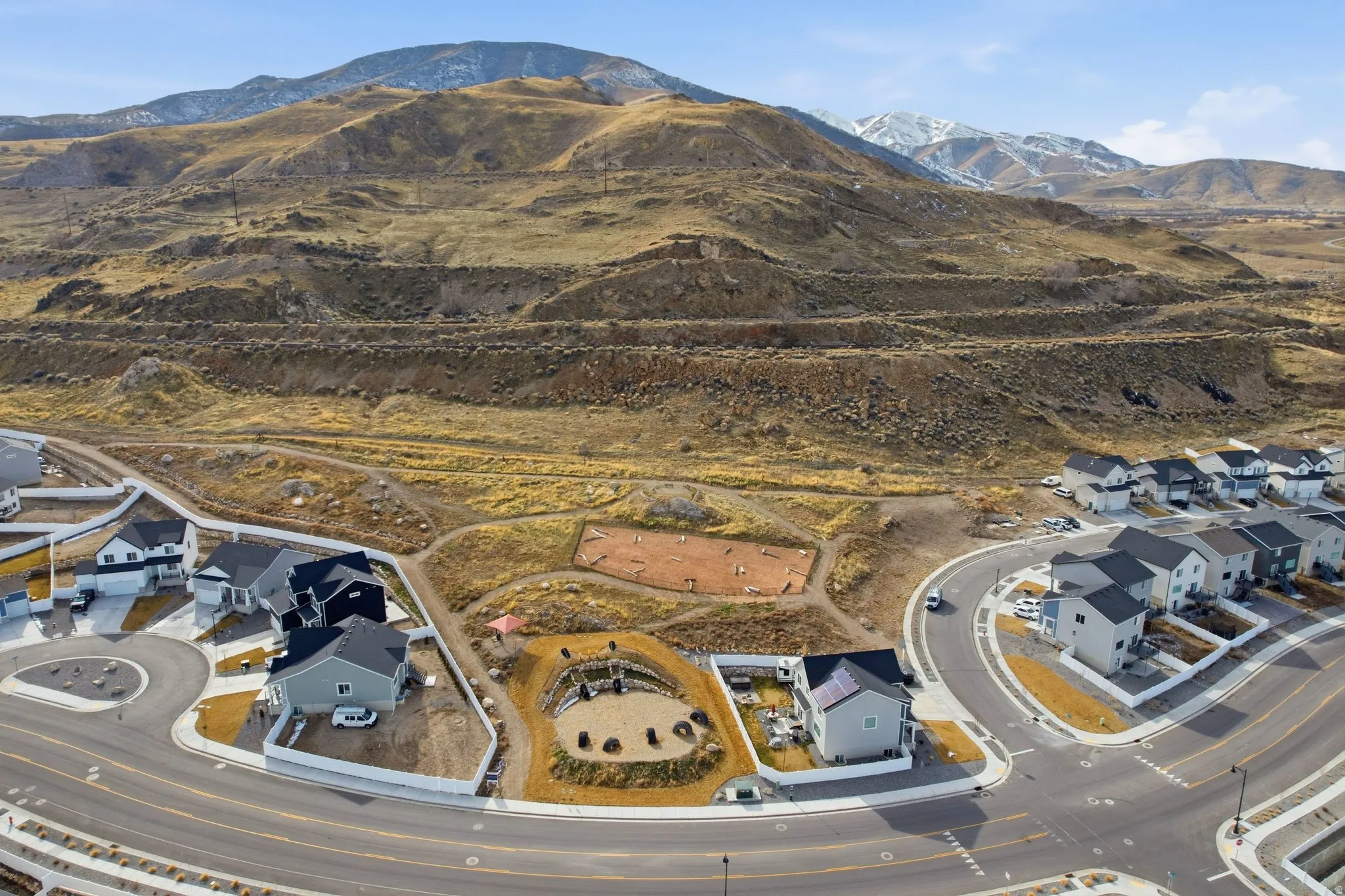 Aerial view of residential area featuring a mountain backdrop