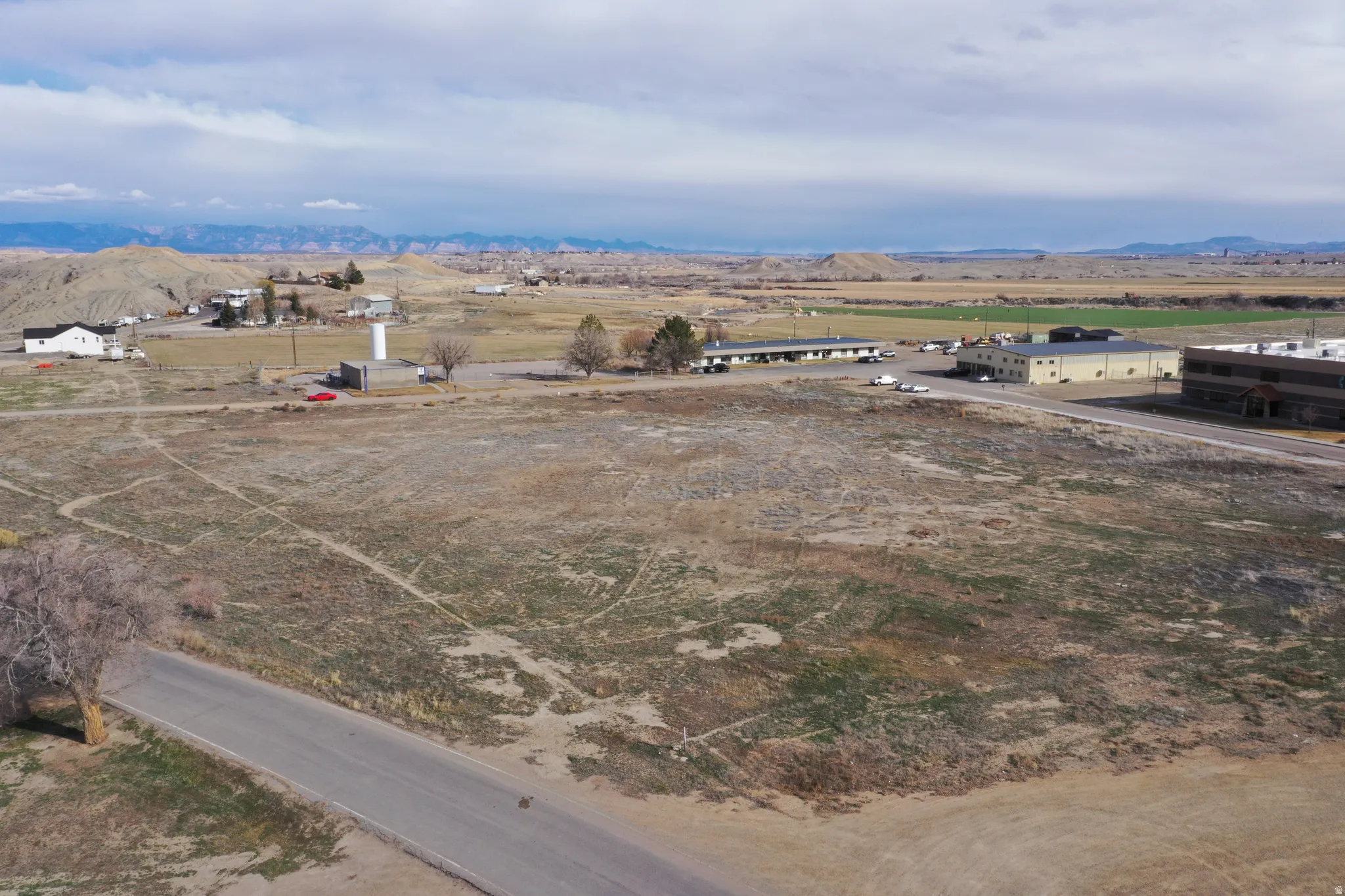 Aerial view of sparsely populated area with a mountainous background