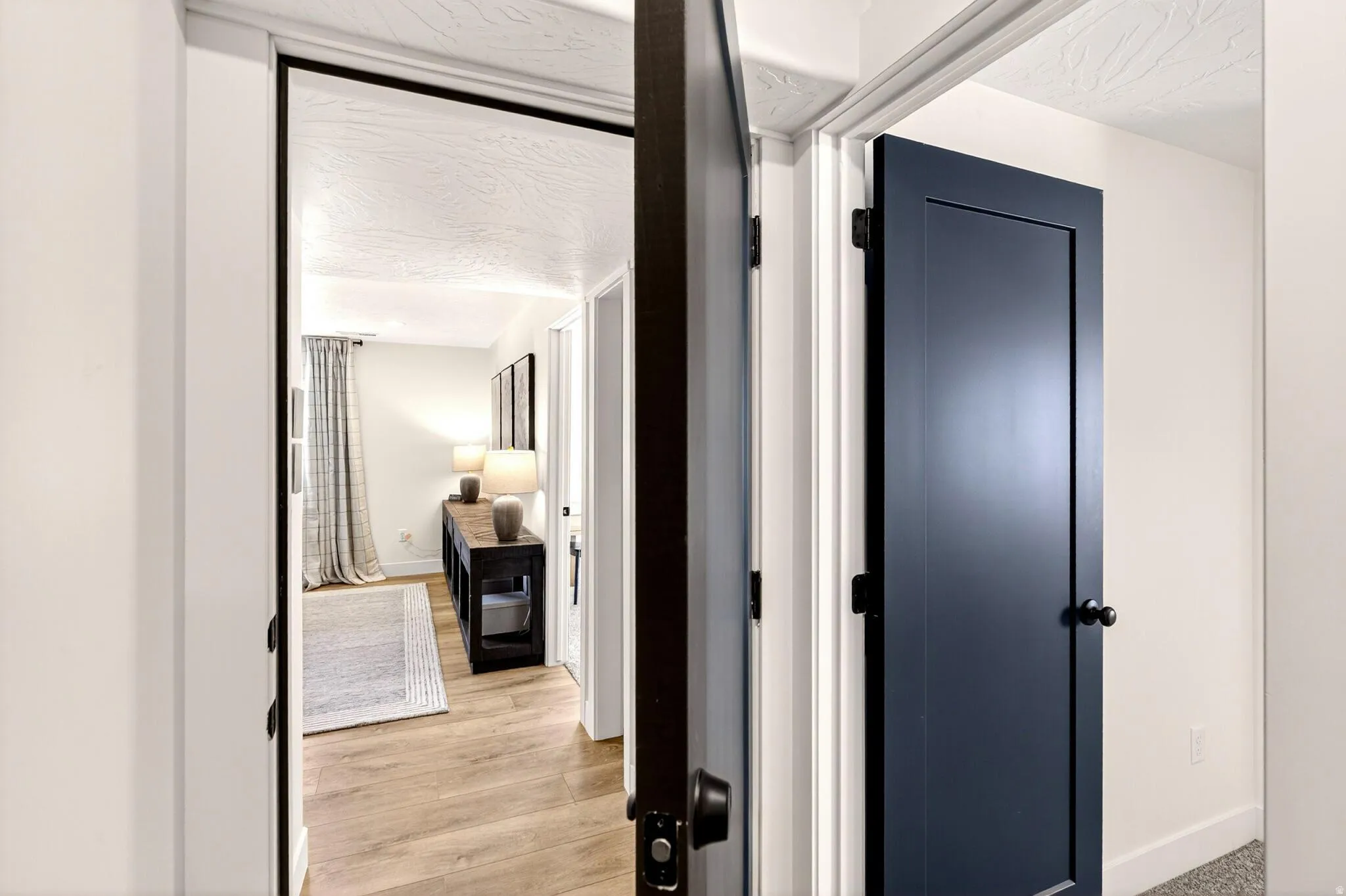 ADU entrance from the interior of the home at the base of the stairs. Option to include the bedroom to the right to make it a 2 bedroom ADU.