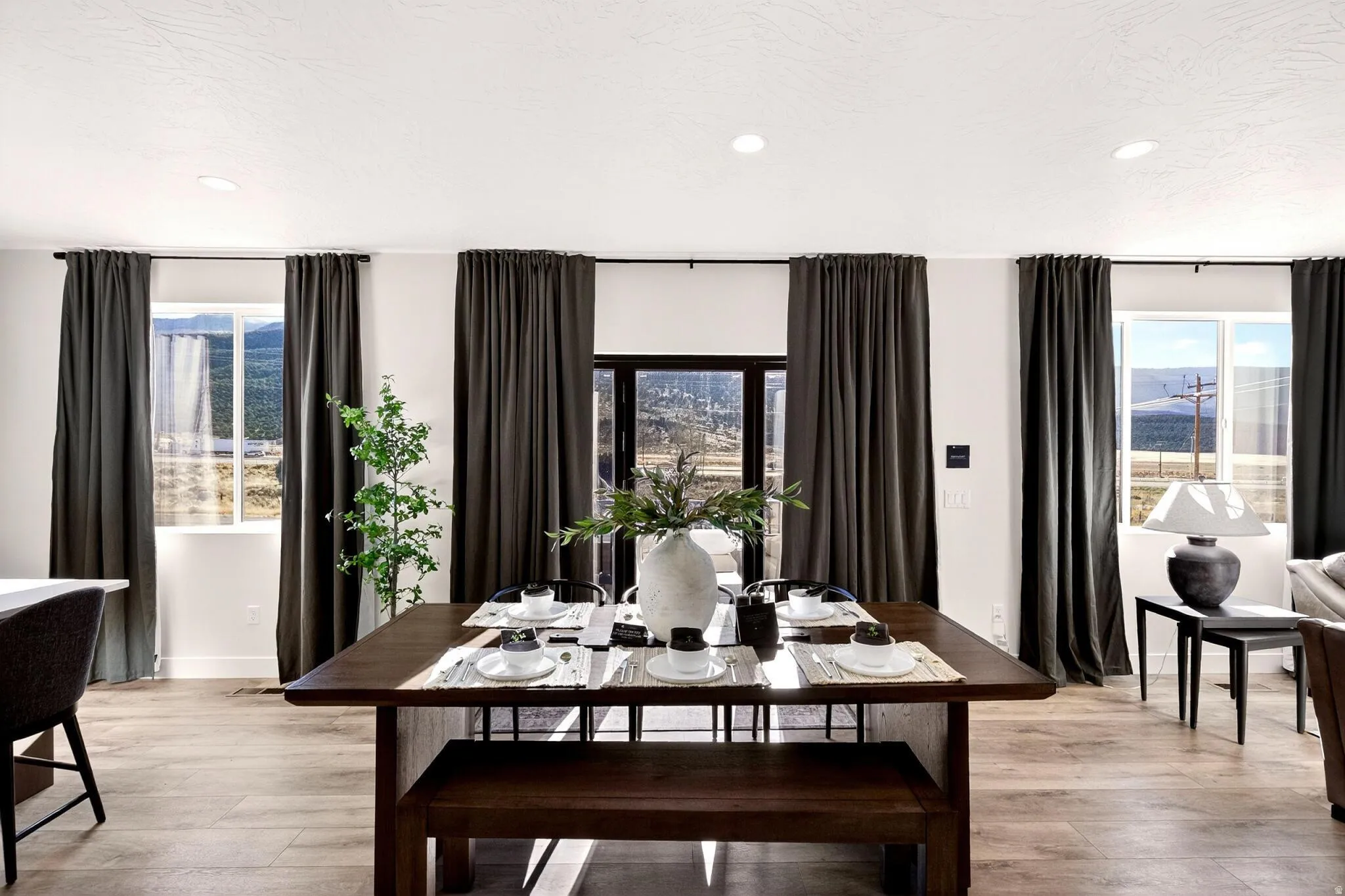 Dining area featuring light wood-type flooring and recessed lighting