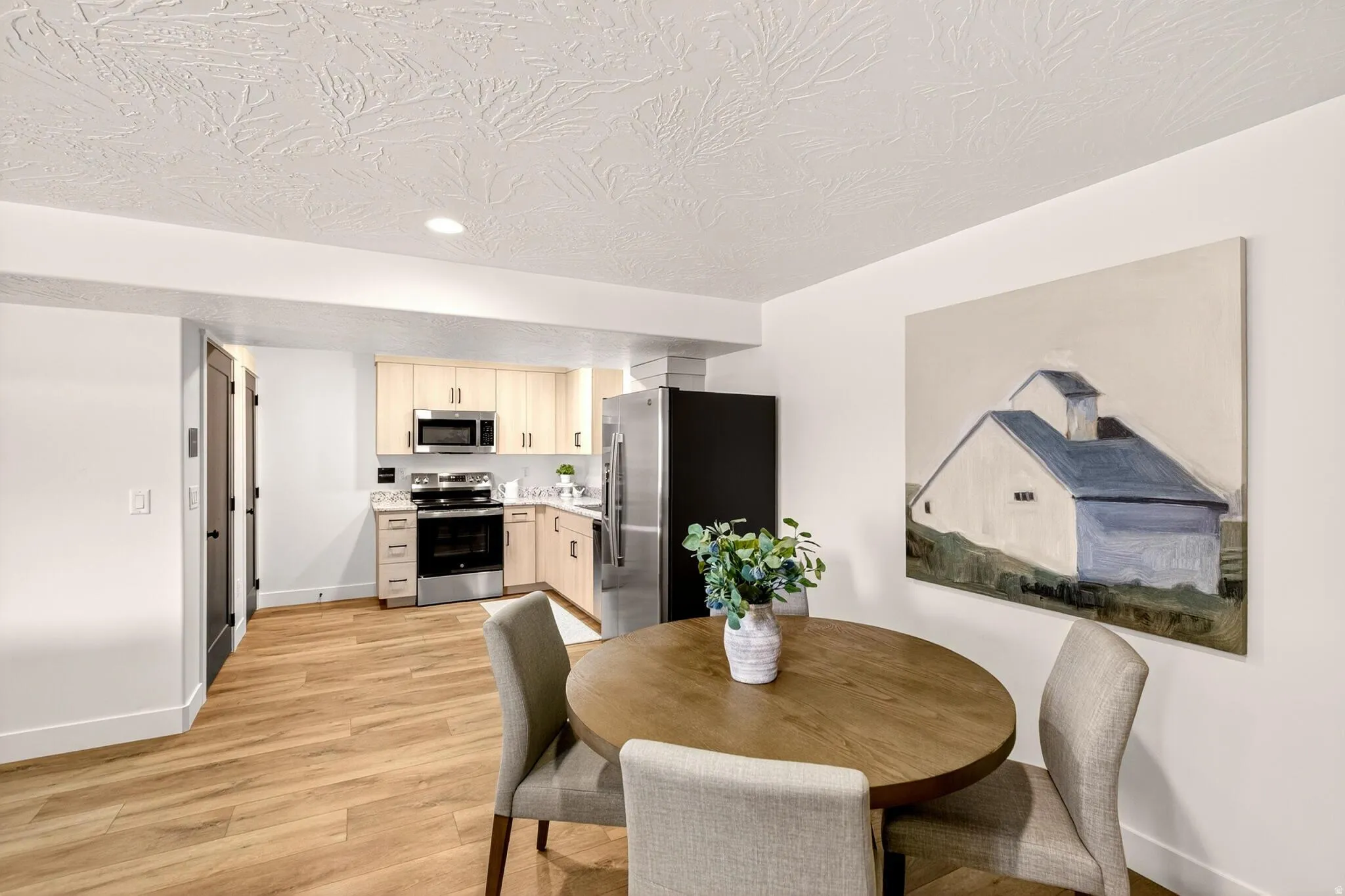 ADU Kitchen with dining area and laundry closet for easy convenience