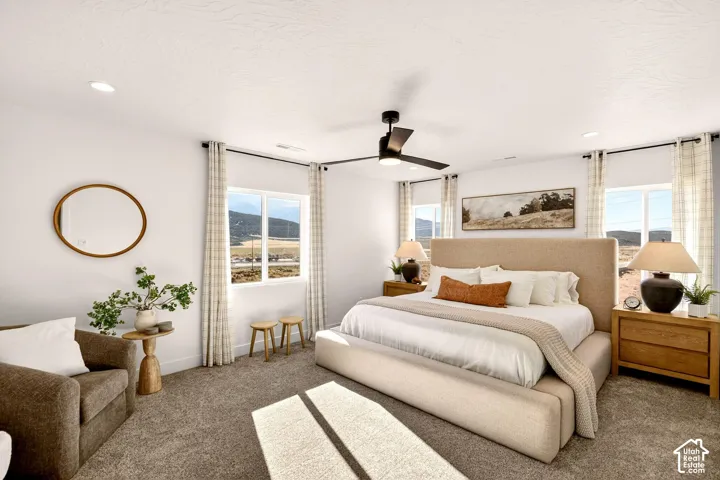 Primary bedroom with on suite bathroom featuring a double vanity, walk-in shower, & walk-in closet.
