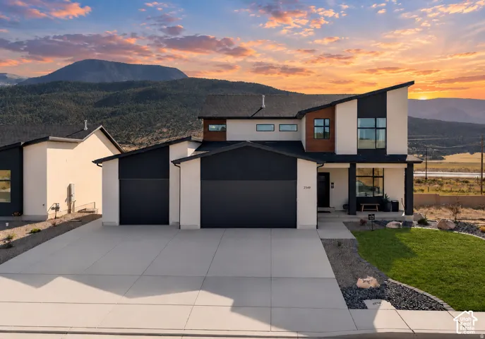 The Rivera features a daylight walkout basement with a private-entry ADU, offering the flexibility to be configured as either a 1-bedroom or 2-bedroom living space. Modern exterior featuring a striking mono-pitch roofline, high-contrast facade with wood-f