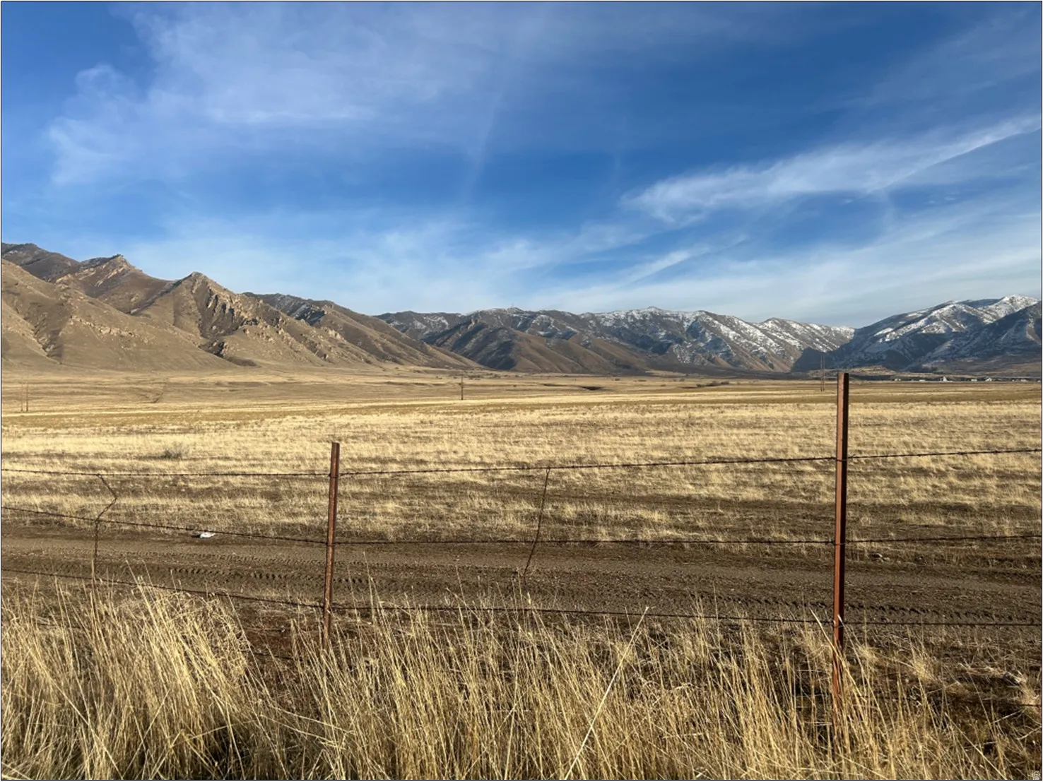 View of mountain backdrop with rural landscape