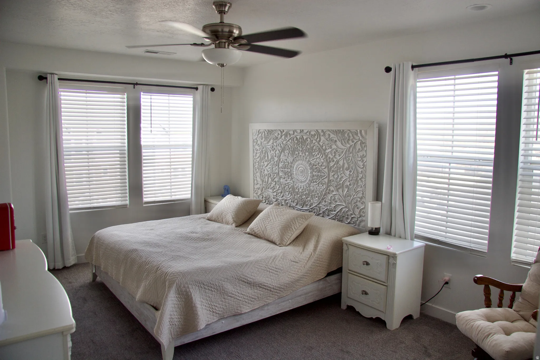 Bedroom with carpet flooring and ceiling fan