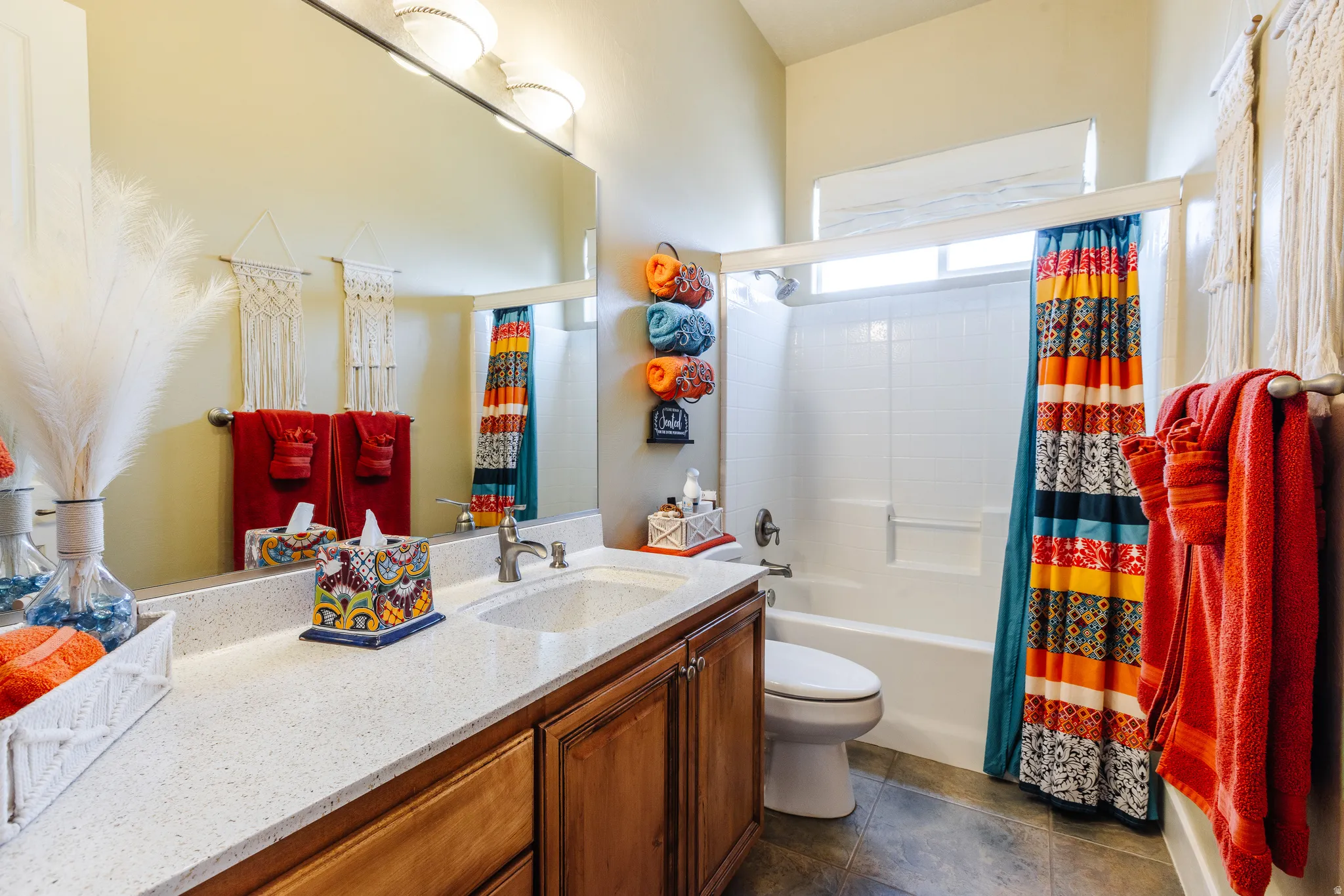 Bathroom featuring vanity and shower / bath combo