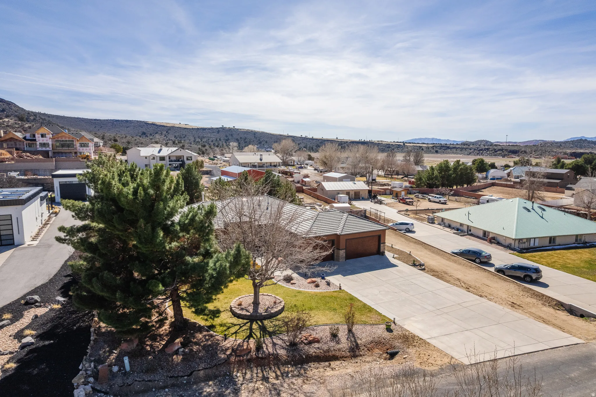 Aerial perspective of suburban area featuring a mountainous background