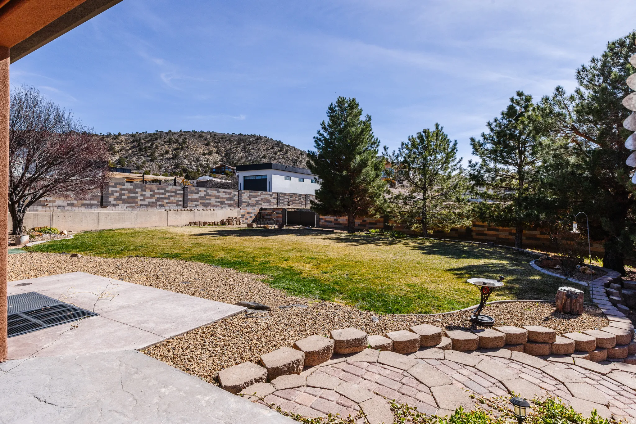 Fenced backyard with a patio area and a mountain view