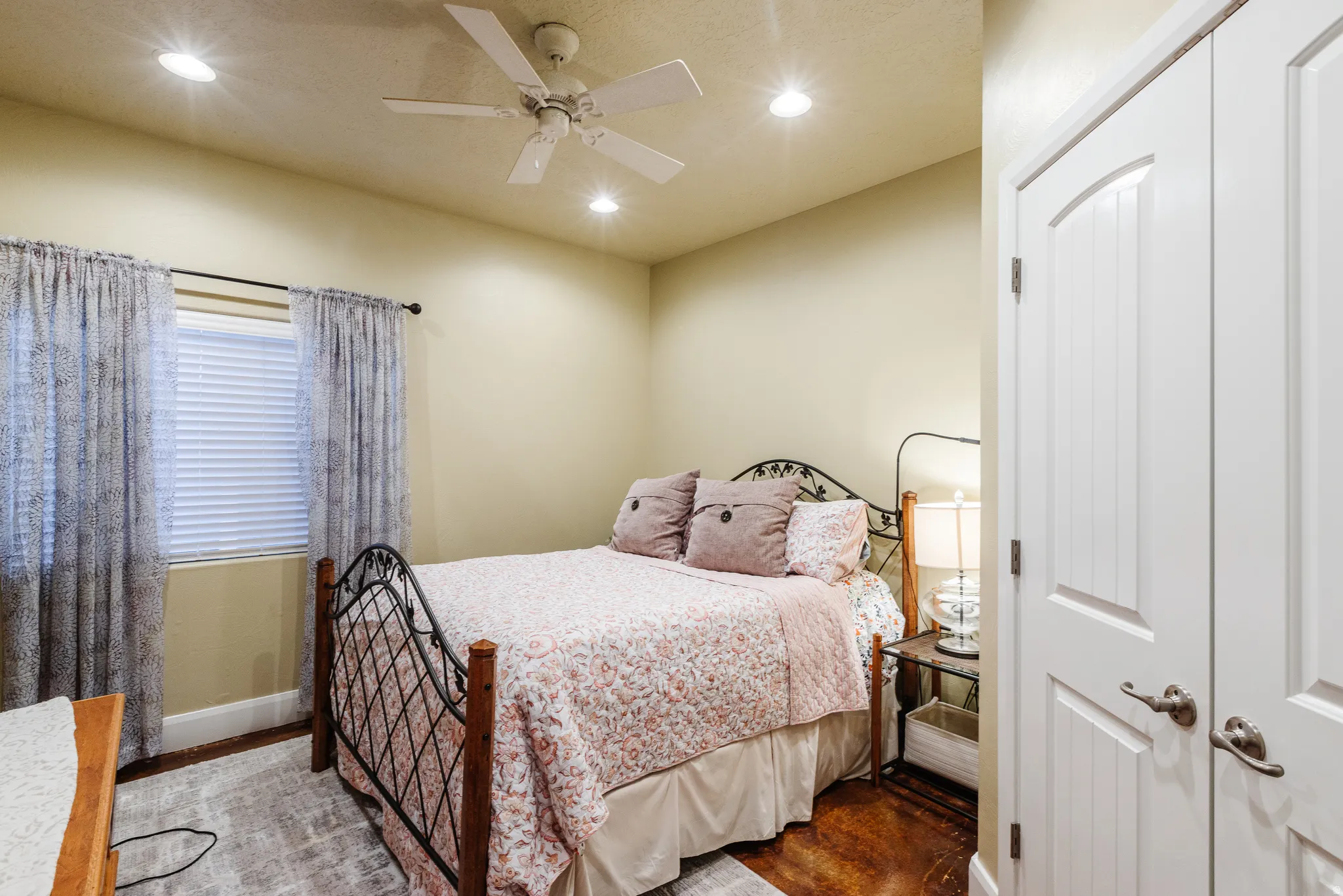 Bedroom featuring recessed lighting, ceiling fan, and wood finished floors