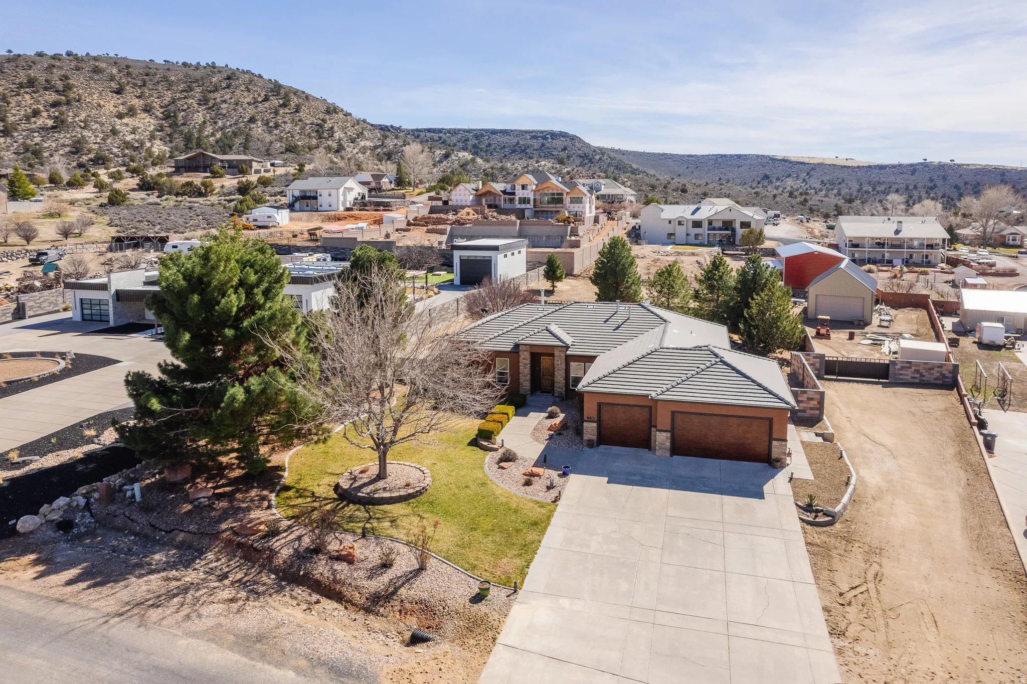 Aerial view of residential area featuring mountains