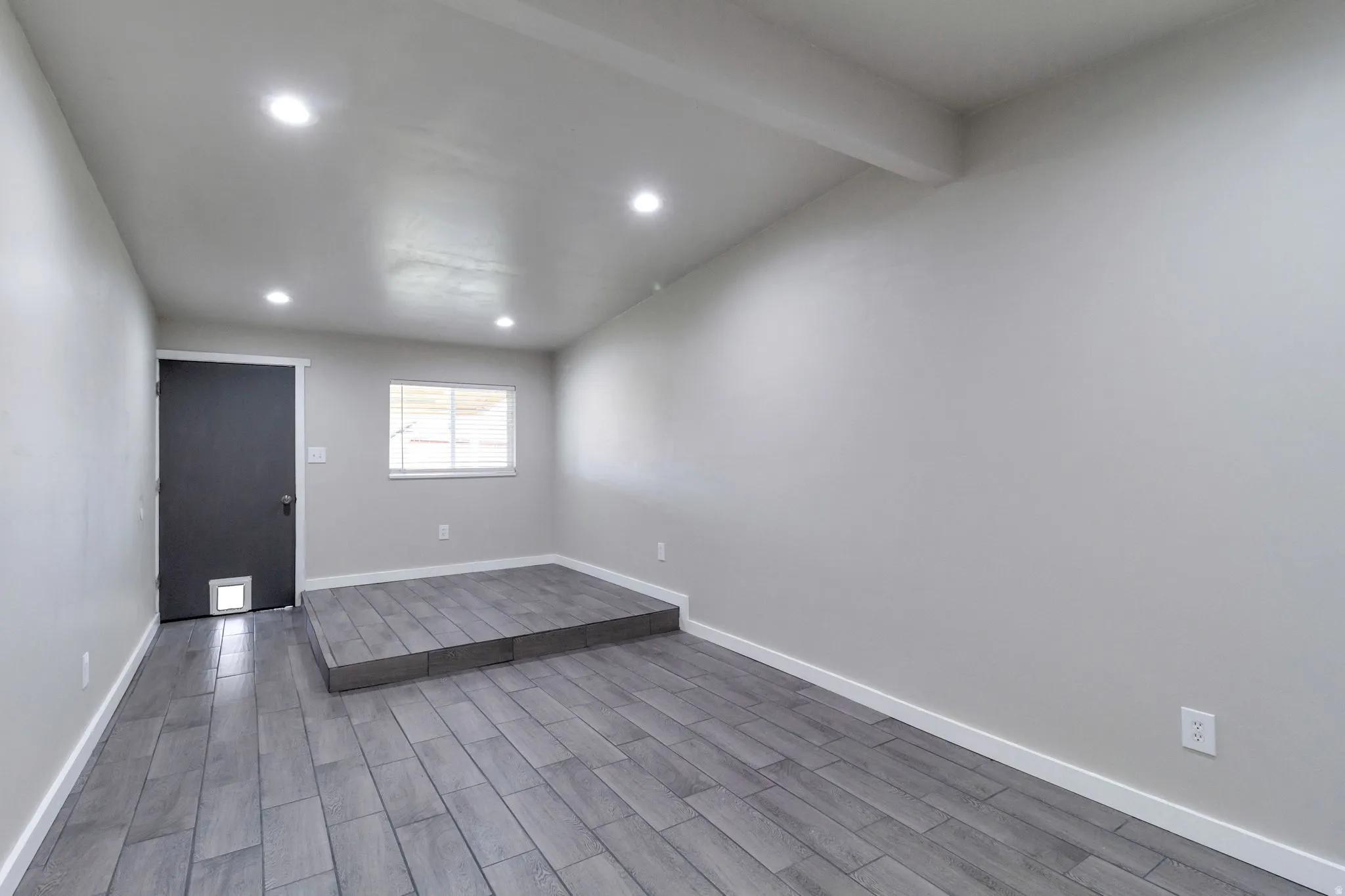 Unfurnished Office room featuring wood finish floors and recessed lighting