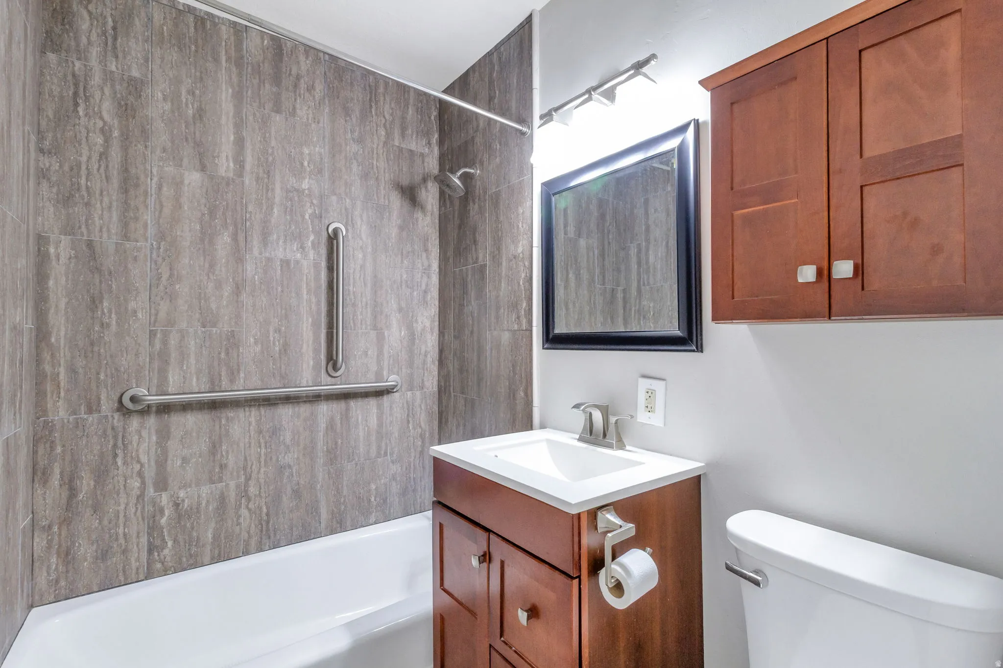 Bathroom featuring vanity and tub / shower combination
