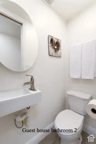 Half bathroom featuring baseboards