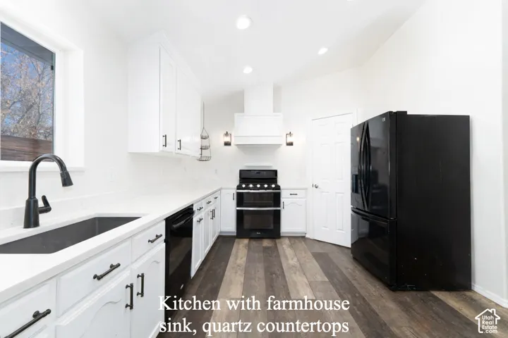 Kitchen with white quartz countertops.