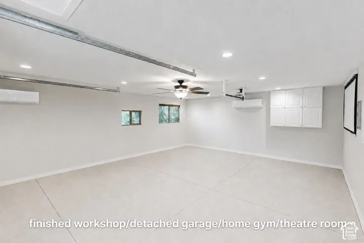 Detached garage used as office/shop/gym/theater room.