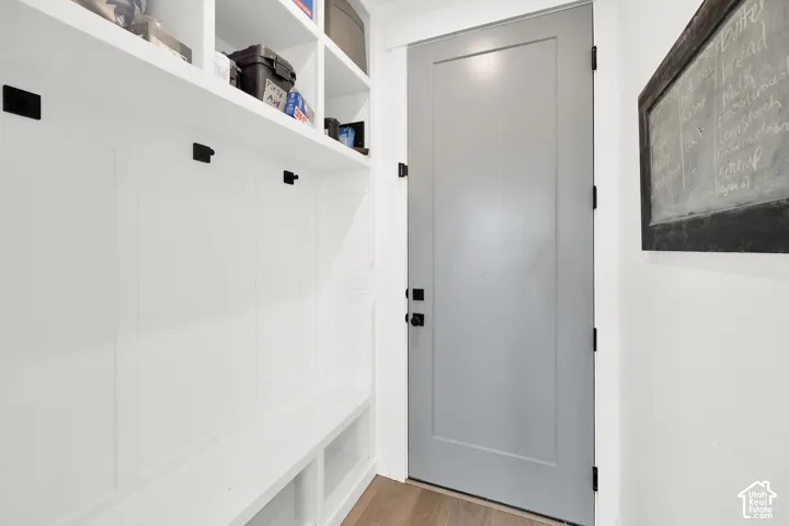 Mudroom featuring light wood finished floors