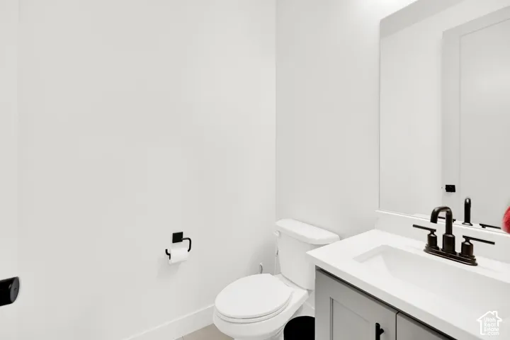 Bathroom with vanity and toilet