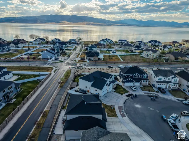 Aerial perspective of suburban area featuring a water and mountain view
