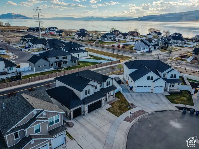 Aerial perspective of suburban area featuring a mountainous background