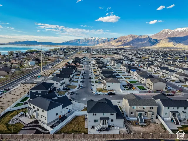 Aerial perspective of suburban area with a mountain backdrop