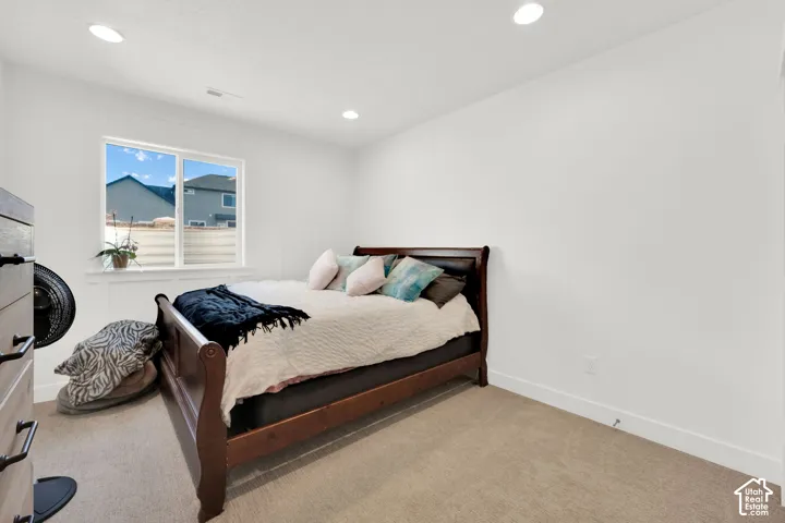 Bedroom with carpet floors and recessed lighting