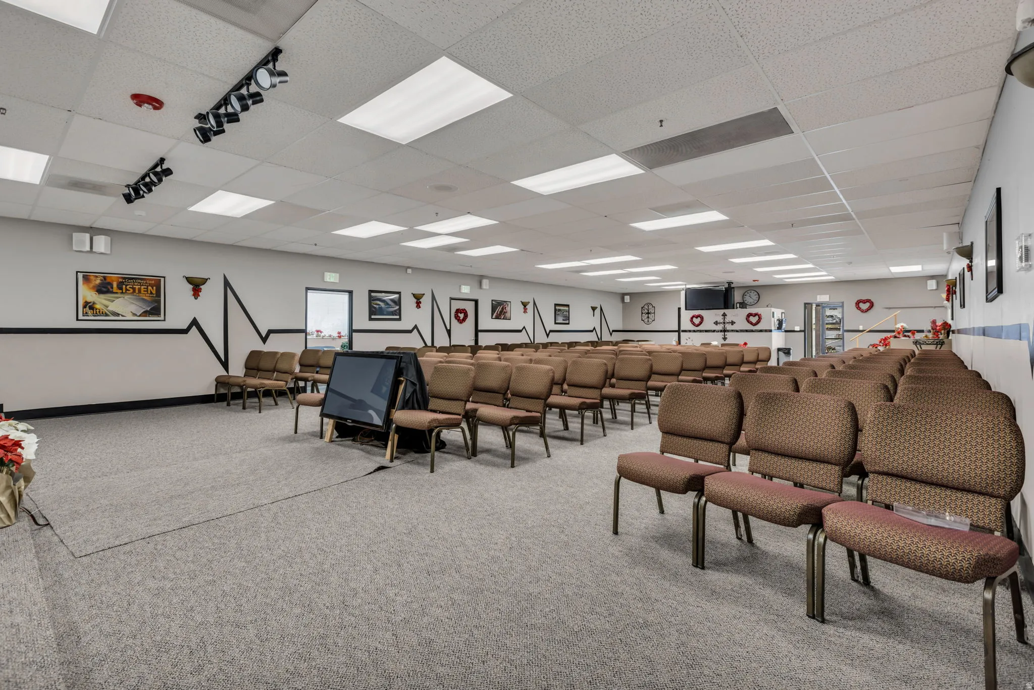 Misc room with a paneled ceiling